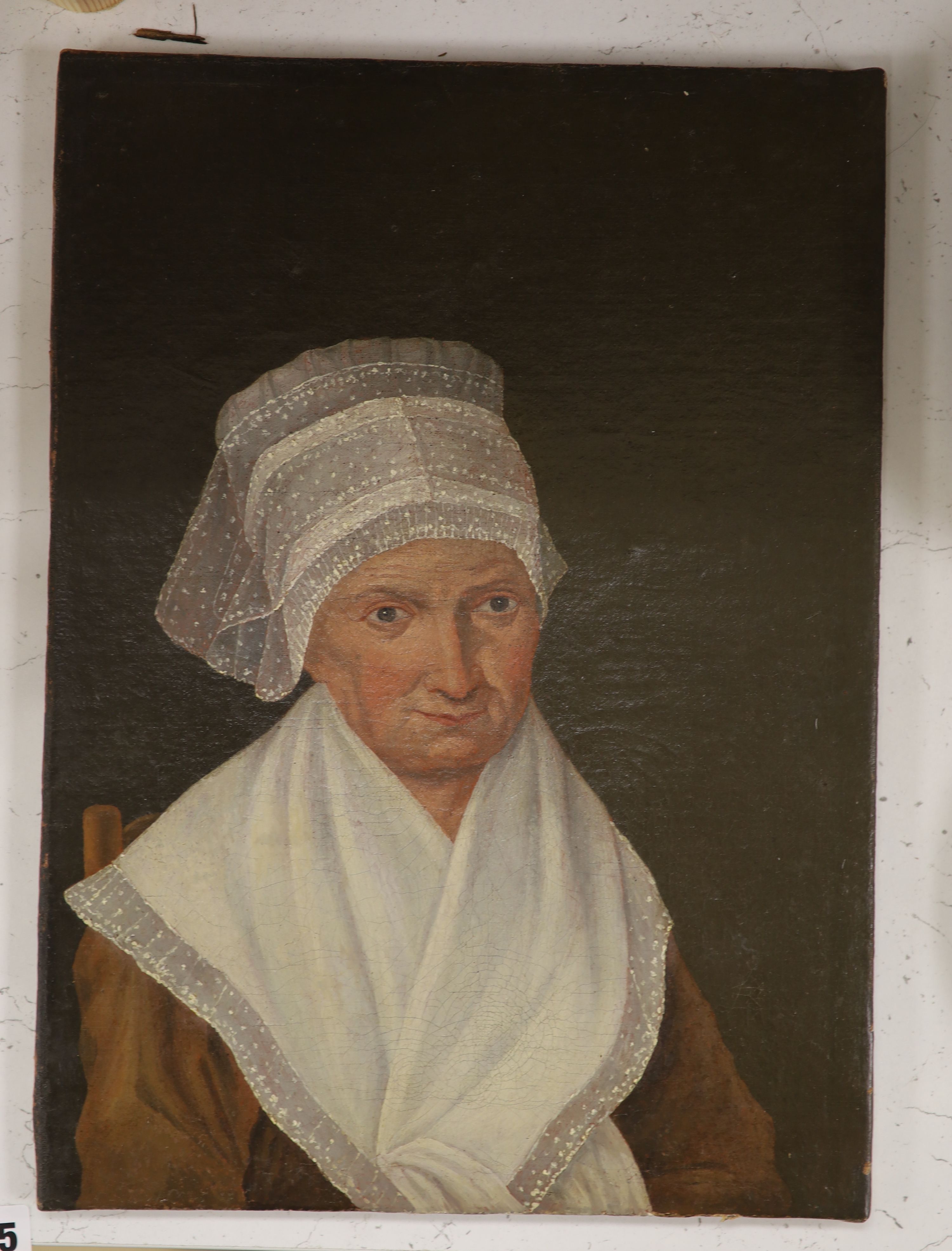 19th century Dutch school, oil on canvas, Portrait of a lady wearing a lace bonnet, 39 x 28cm, unframed